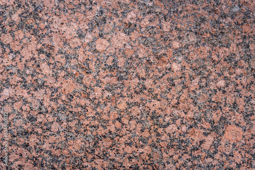 Closeup view of textured glossy pink granite slab © Cyril Redor