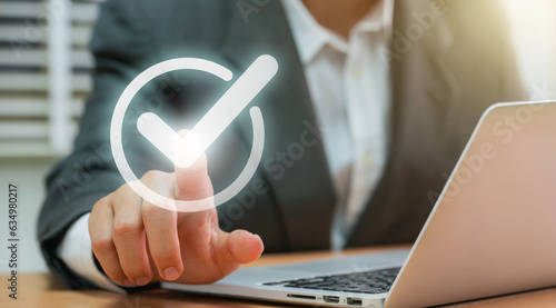 Canvas Print Businessmen point to tick correct sign mark in checkbox for approve quality document and project control