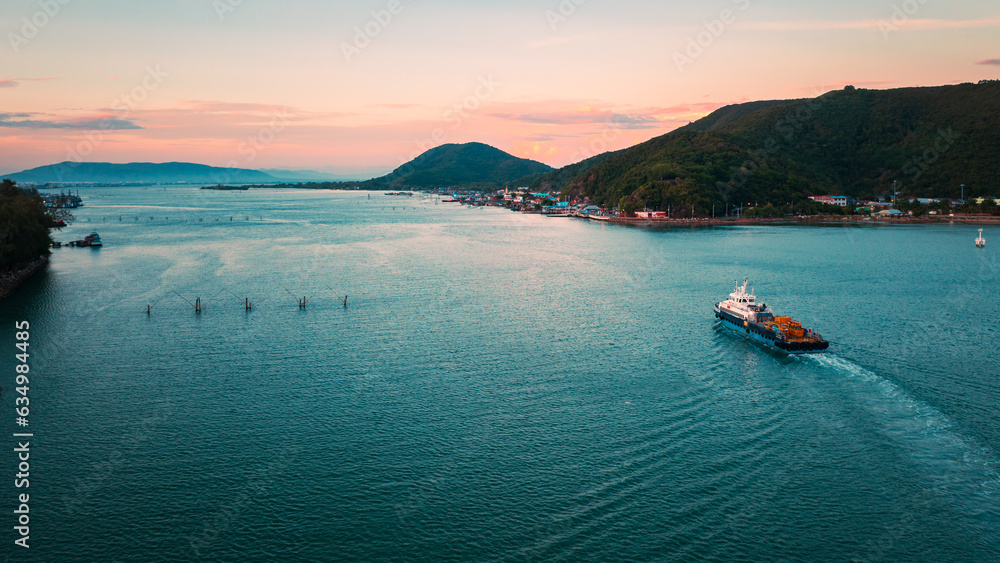 Panoramic aerial view of a industrial cargo container ship traveling over calm, open sea with copy space. Panoramic aerial view of a industrial cargo container ship traveling over calm, open sea with copy space.