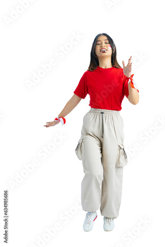 Indonesian girl celebrate Indonesian independence day on 17 August with a marbles race using a spoon photo