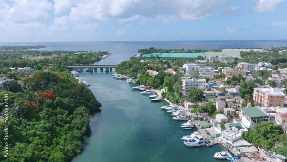 Birdseye view over Rio Romana river mouth and bridge in Dominican Republic Birdseye view over Rio Romana river mouth and bridge in Dominican Republic