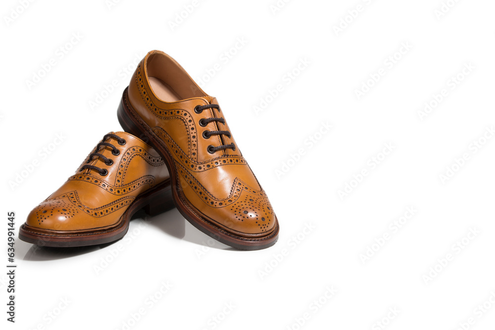 Pair of Tanned Brogue Derby Shoes Made of Calf Leather with Rubber Sole Isolated Over Pure White Background. Pair of Tanned Brogue Derby Shoes Made of Calf Leather with Rubber Sole Isolated Over Pure White Background.