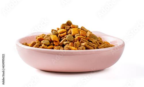 Porcelain bowl with dry cat food on a white background close-up