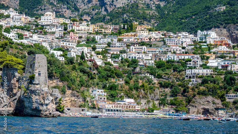 Ancient tower and Fornillo beach in Positano seen from the sea. Amalfi Coast, Italy.