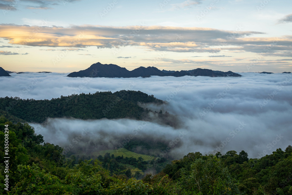 mountain summit covered by sea of cloud with fantastic sky in the morning (Tak province, Thailand)