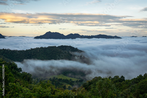 mountain summit covered by sea of cloud with fantastic sky in the morning (Tak province, Thailand)