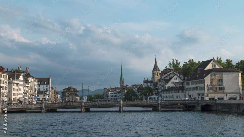 Bridge Over Limmat River In The Cityscape Of Zurich In Switzerland. Timelapse Bridge Over Limmat River In The Cityscape Of Zurich In Switzerland. Timelapse