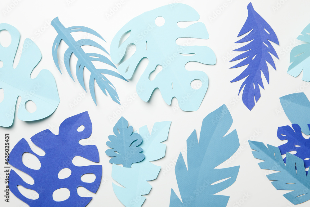 Paper blue tropical leaves on a light background Paper blue tropical leaves on a light background