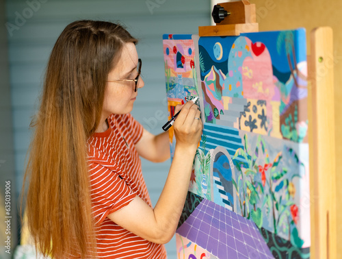 Artist woman with a painting