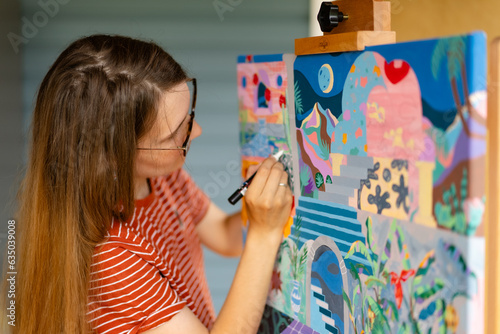 Artist woman with a painting