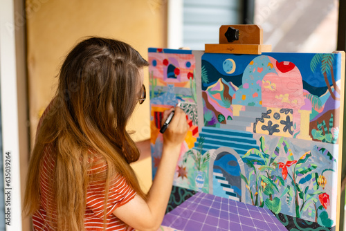 Artist woman with a painting