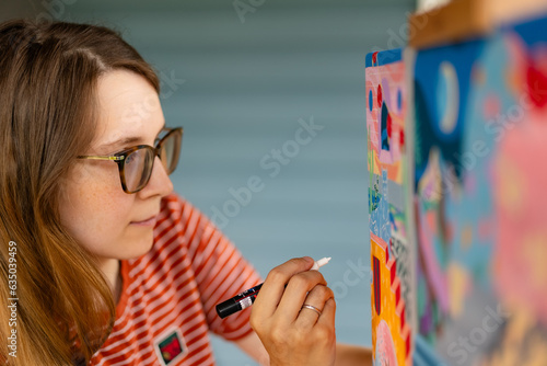 Artist woman with a painting