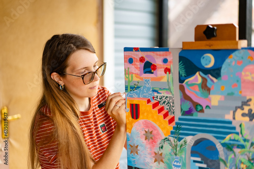 Artist woman with a painting