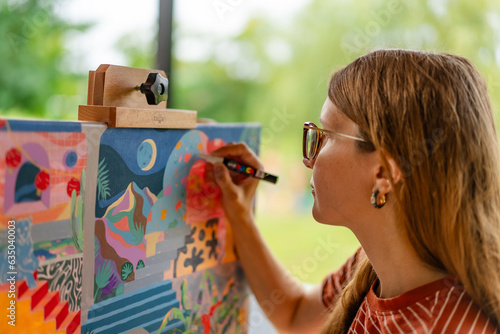 Artist woman with a painting