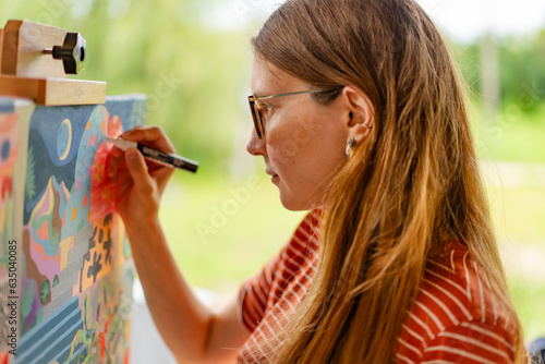 Artist woman with a painting