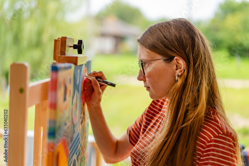 Artist woman with a painting