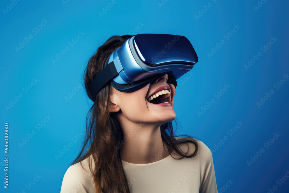 Happy Woman In Vr Glasses On Blue Background. Vr Enjoyment, Female Empowerment, Women In Tech, Virtual Reality, Color Psychology, Digital Revolution, Technology Advancements, Social Impact Happy Woman In Vr Glasses On Blue Background. Vr Enjoyment, Female Empowerment, Women In Tech, Virtual Reality, Color Psychology, Digital Revolution, Technology Advancements, Social Impact
