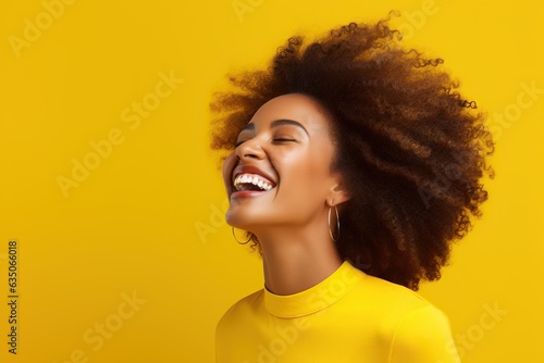Joyful Laughter of African Woman On a Yellow Backdrop