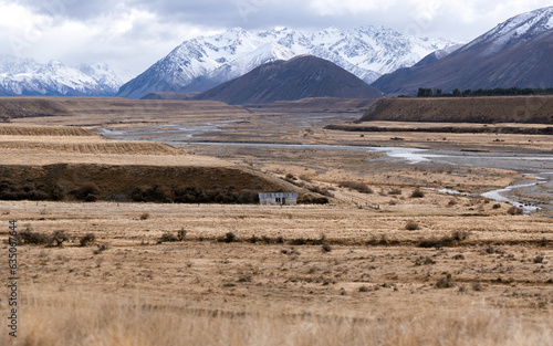 New Zealand backcountry farm with mountain landscape