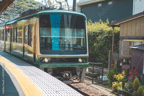 Enoshima tram or electric railway train at Fujisawa and Kamakura, Kanagawa, Japan photo
