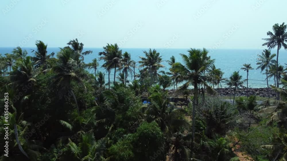 aerial view of fishing village with many boats moored on the beach sand Kerala, South India aerial view of fishing village with many boats moored on the beach sand Kerala, South India