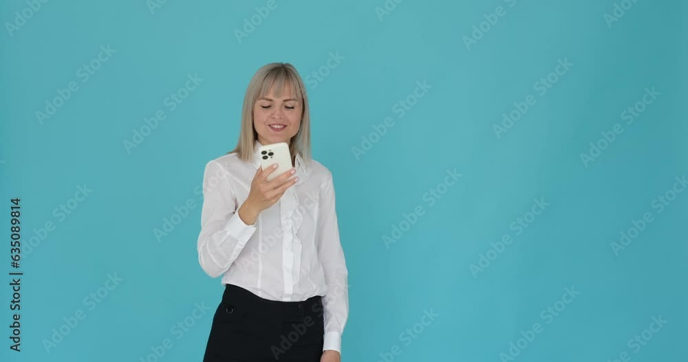 Composed businesswoman engaged in a conversation while celebrating success with a serene expression on a calming blue background. Her poised demeanor and content smile.