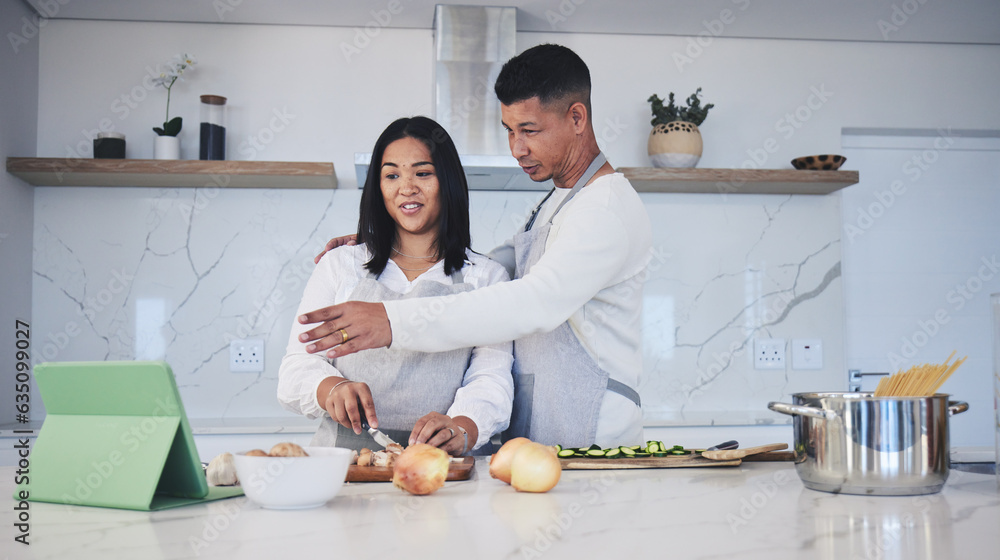 Digital tablet, cooking and couple in a kitchen, talking and bonding with love, marriage and fun activity. Home, man and woman with tech, online recipe and video with instructions and prepare a meal Digital tablet, cooking and couple in a kitchen, talking and bonding with love, marriage and fun activity. Home, man and woman with tech, online recipe and video with instructions and prepare a meal