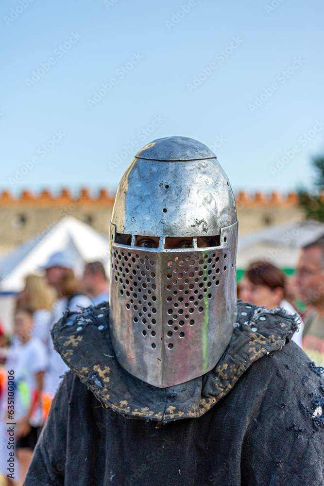 Naklejka premium Historical restoration of knightly fights. Summer time medieval festival .Festival of medieval culture in the old fortress with knightly battles.