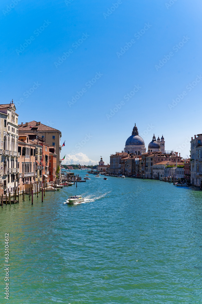 Scenic view over Grand Canal at the old town of Venice seen from Accademia Bridge on a sunny summer day. Photo taken August 7th, 2023, Venice, Italy.