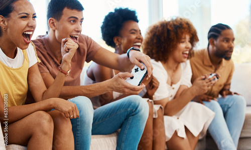 Excited friends together on couch  video game fun and relax in home living room playing with controller. Online gaming  virtual esports app and sofa  happy group of gamer men and women in apartment.