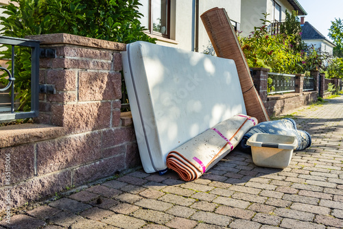 Bulk garbage day concept, miscellaneous rubbish items put on a street for council bulk waste collection photo