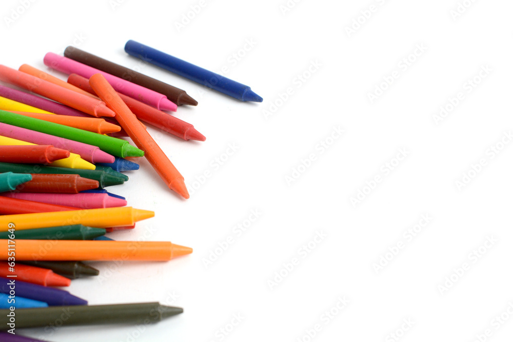 Fototapeta premium Crayons lined up isolated on white background.