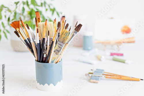 Set of painting brushes and colors for artists. Craft artistic background. Recomforting, destressing creative hobby, art therapy