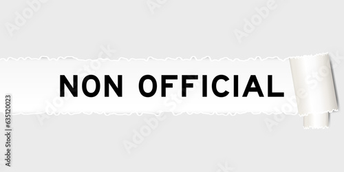 Ripped gray paper background that have word non official under torn part