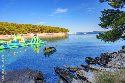 Beach and boats on the Adriatic coast. Primosten, Croatia.