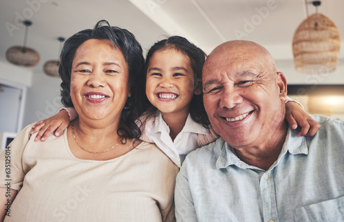 Smile, relax and portrait of grandparents and child on sofa for happy, bonding and support. Hug, happiness and love with Mexico family and embrace in living room at home for calm, cheerful and peace © Azee/peopleimages.com