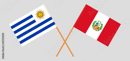 Crossed flags of Peru and Uruguay. Official colors. Correct proportion