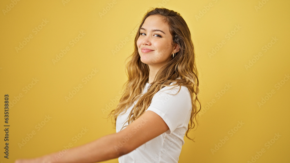 Young beautiful hispanic woman smiling confident standing over isolated yellow background Young beautiful hispanic woman smiling confident standing over isolated yellow background