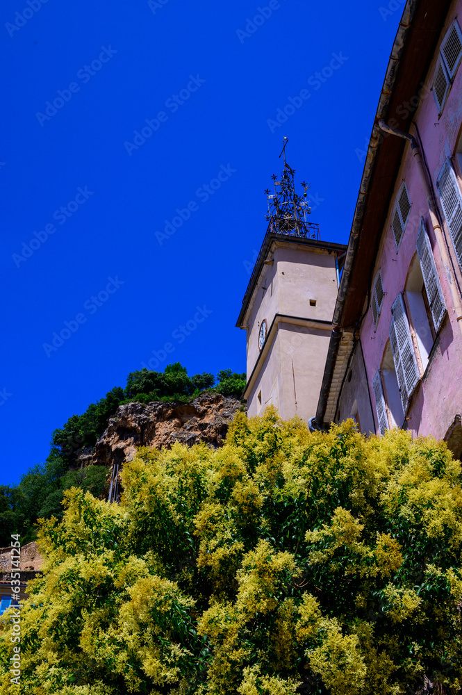 Obraz premium Travel destination, small ancient village Cotignac in Var, Provence, surrounded by vineyards and cliffs with troglodytes houses.