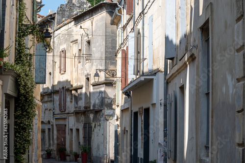 View on old streets and houses in ancient french town Arles, touristic destination with Roman ruines, Bouches-du-Rhone, France © barmalini