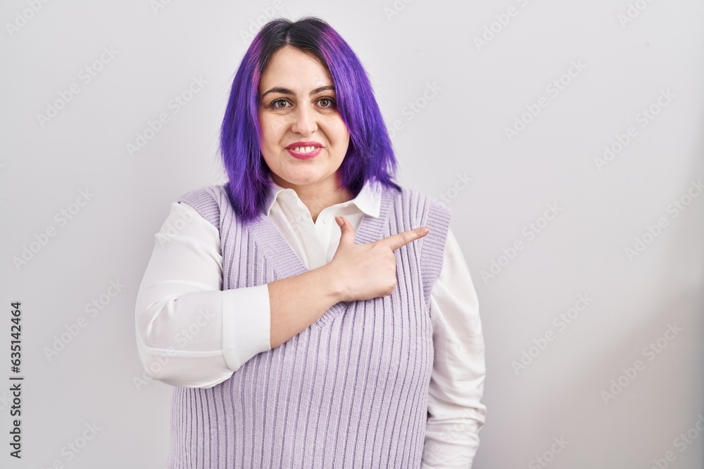 Plus size woman wit purple hair standing over white background cheerful with a smile on face pointing with hand and finger up to the side with happy and natural expression Plus size woman wit purple hair standing over white background cheerful with a smile on face pointing with hand and finger up to the side with happy and natural expression
