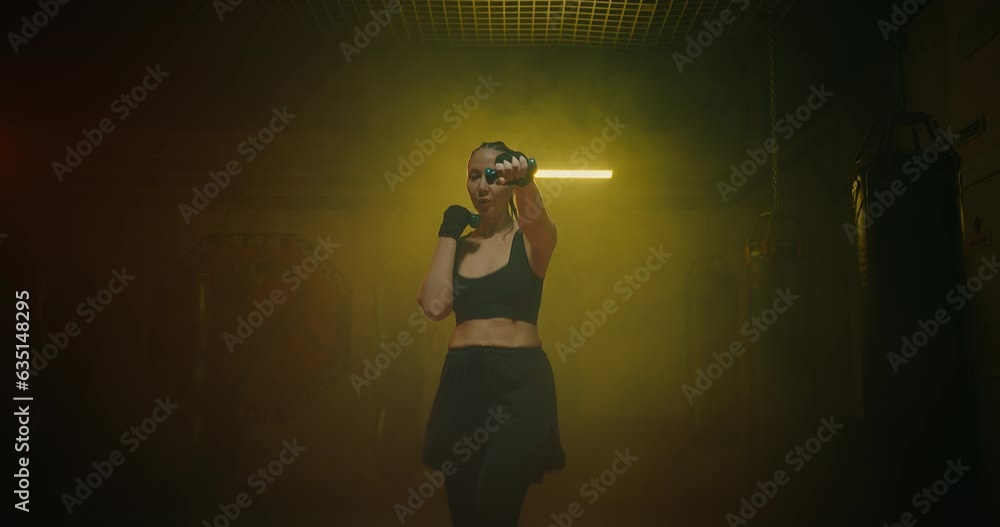 athletic woman training in modern gym at night, cinematic medium shot with sportswoman, 4K, Prores athletic woman training in modern gym at night, cinematic medium shot with sportswoman, 4K, Prores