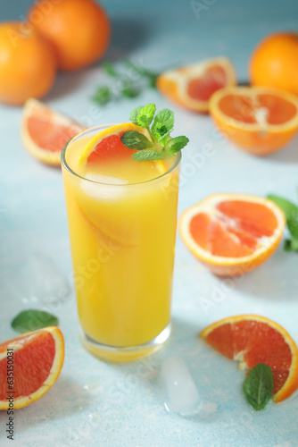 Fototapeta Naklejka Na Ścianę i Meble -  Red oranges juice with mint and ice
