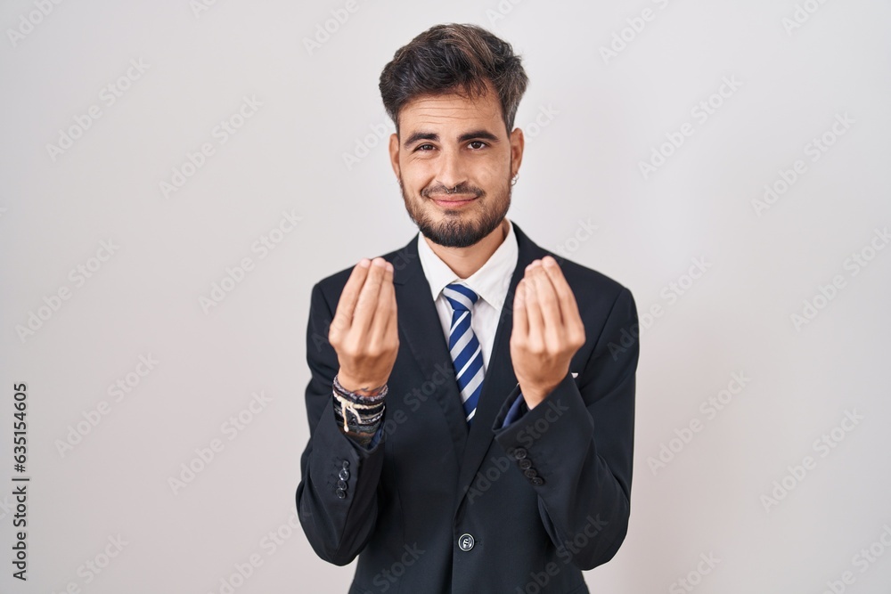 Young hispanic man with tattoos wearing business suit and tie doing money gesture with hands, asking for salary payment, millionaire business Young hispanic man with tattoos wearing business suit and tie doing money gesture with hands, asking for salary payment, millionaire business