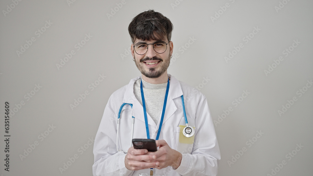 Young hispanic man doctor smiling using smartphone over isolated white background Young hispanic man doctor smiling using smartphone over isolated white background