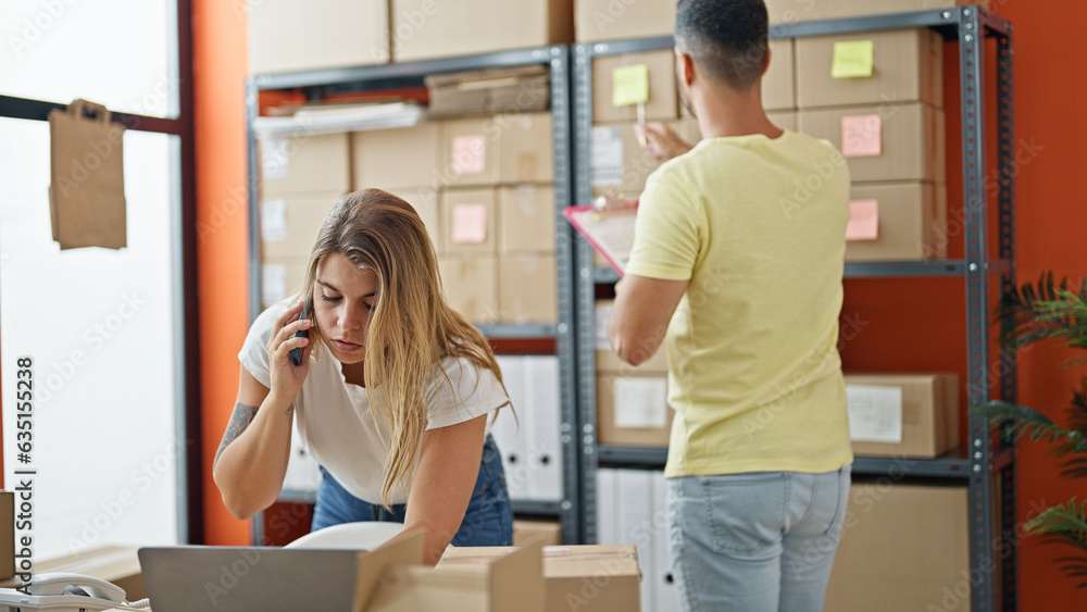 Man and woman ecommerce business workers working at office Man and woman ecommerce business workers working at office