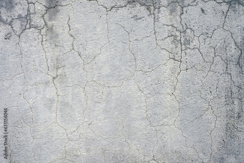 Texture of old wall. Cracks in grey color wall