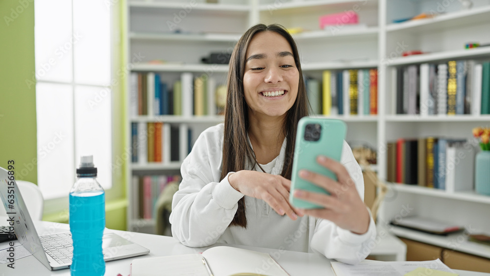Young beautiful hispanic woman student smiling confident having video call at university classroom Young beautiful hispanic woman student smiling confident having video call at university classroom