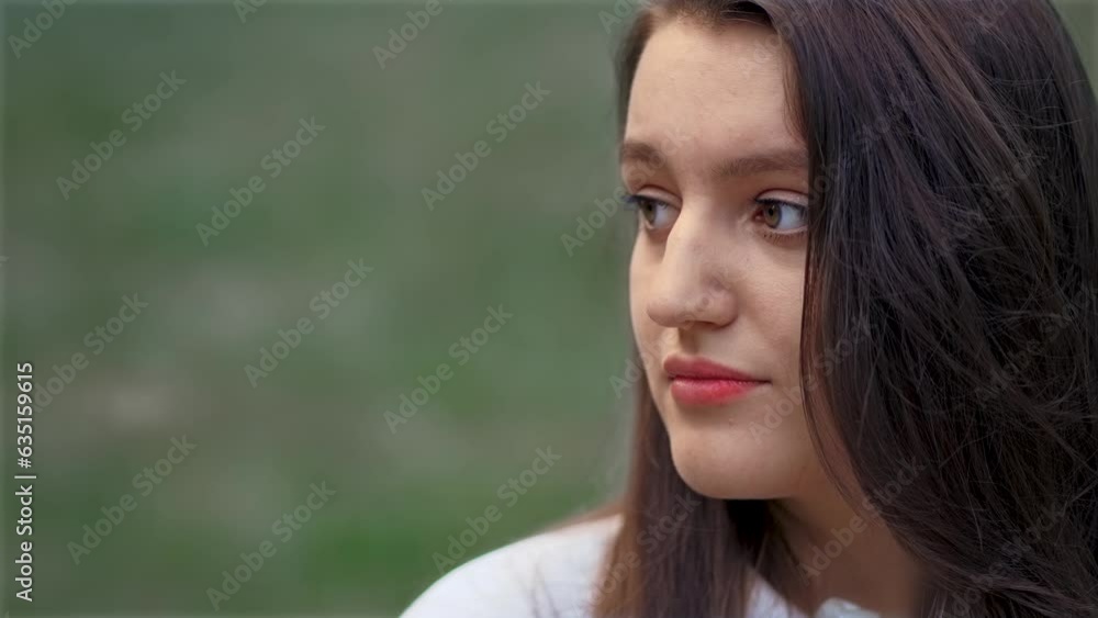 Thoughtful young latin woman at park. Joy, positive and love female looking at left side of frame. Relax leisure activity, active lifestyle, cheerful confident attractive girl Thoughtful young latin woman at park. Joy, positive and love female looking at left side of frame. Relax leisure activity, active lifestyle, cheerful confident attractive girl