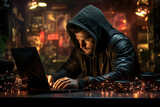 A hacker in a hoodie sits at a laptop and looks at a screen with green symbols. Concept of cyber security. Protection of information data.